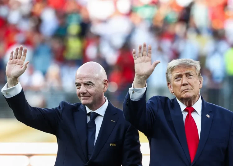 Donald Trump lingers on stage to steal FIFA World Cup spotlight